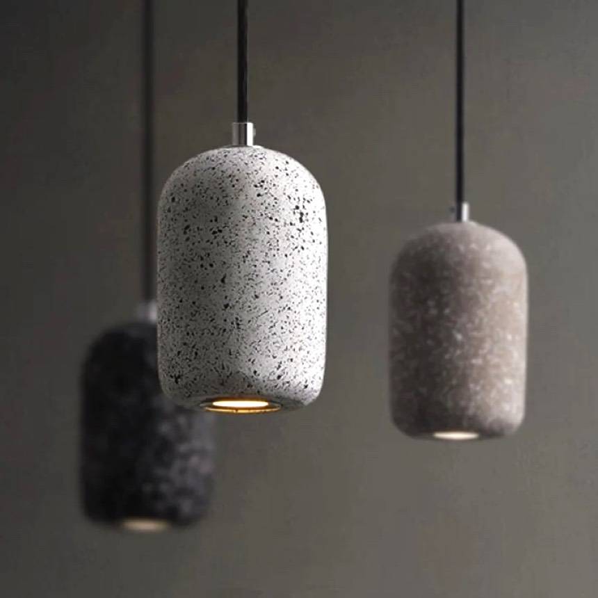 Hoshi pendant lights, small speckled terrazzo shades glowing in a row