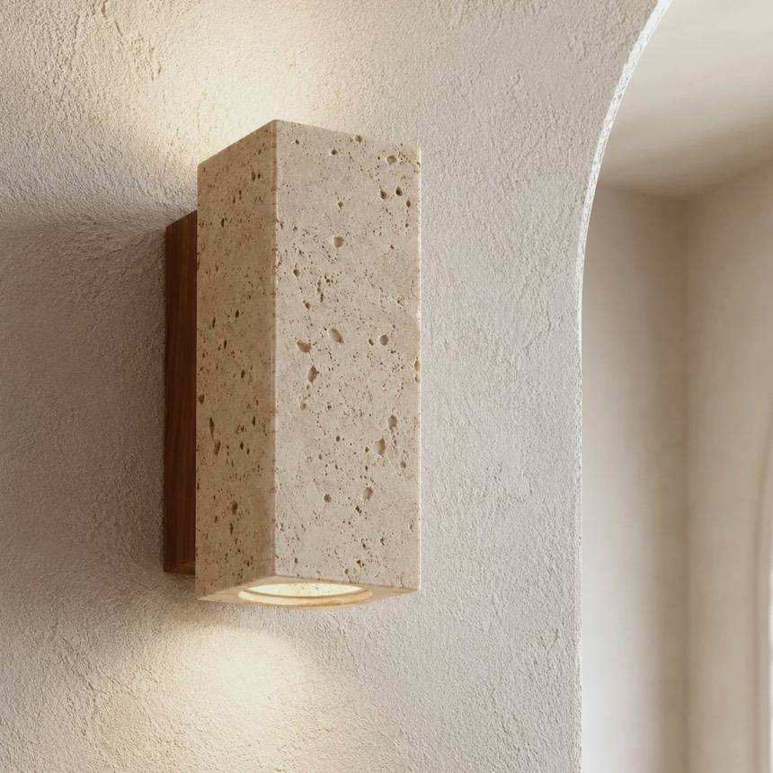Kabe wall light, a slim natural travertine block on a timber back