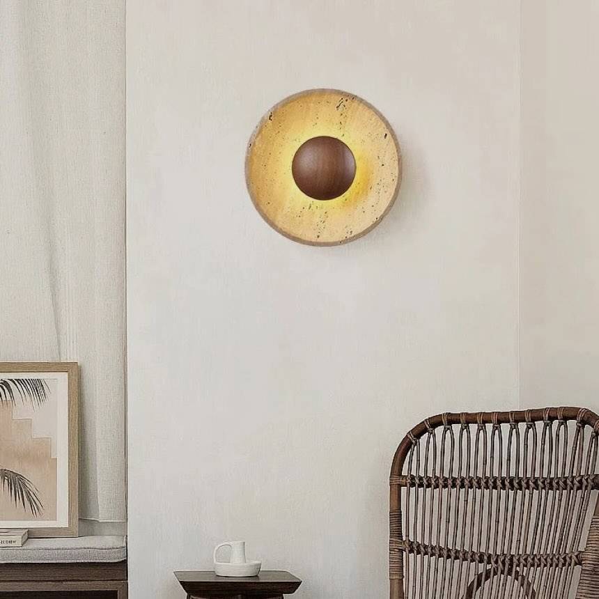 Hinode wall light, a natural travertine disc around a timber centre