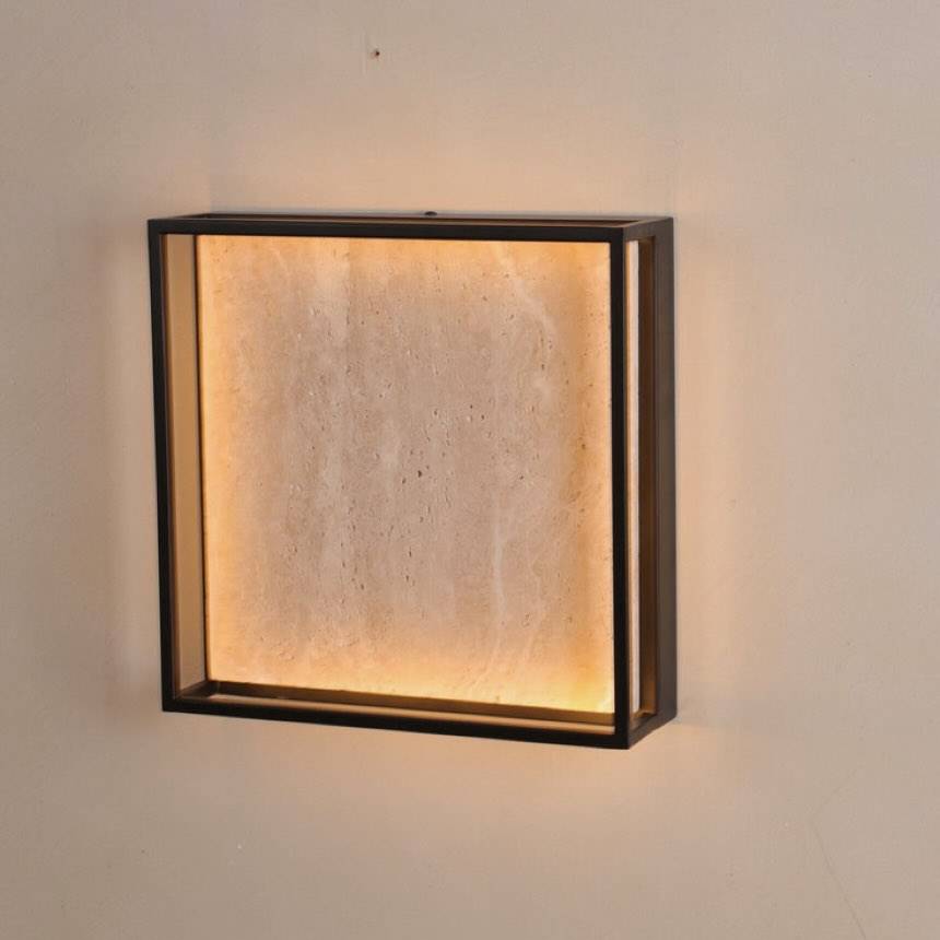 Mado outdoor wall light, a glowing travertine panel in a black metal frame